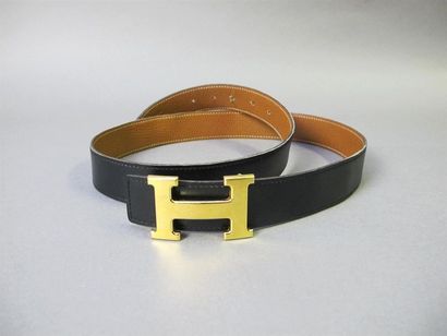 null HERMES Paris
Belt in black box, brown grained leather interior. H clasp in gilded...