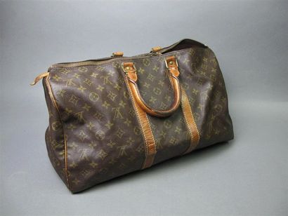 null LOUIS VUITTON
"Speedy" model bag in monogram canvas and handles in natural leather....