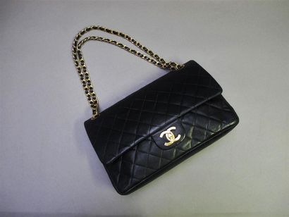 null CHANEL Paris
"Timeless" handbag in black quilted lamb leather with double flaps,...