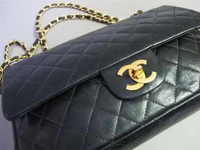 null CHANEL Paris
"Timeless" handbag in black quilted lamb leather with double flaps,...