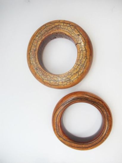 null BAMILEKE CAMEROONTwo
 ivory bracelets with orange-brown patina,one cracked.Circa...