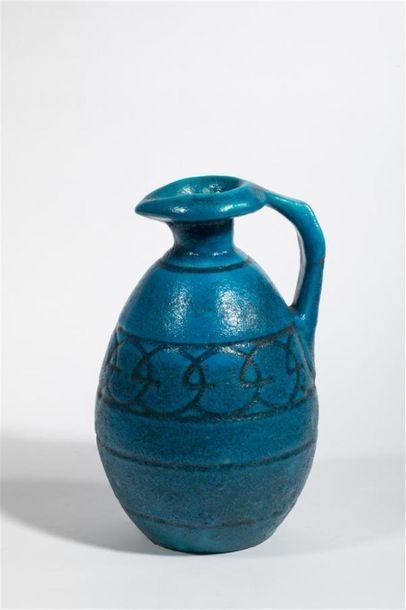 null LACHENAL Raoul (1885-1956) 
Pichet en céramique à couverte émaillée bleue turquoise...