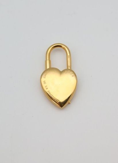null HERMES Paris
Cadenas de sac en métal doré en forme de coeur célébrant "l'année...