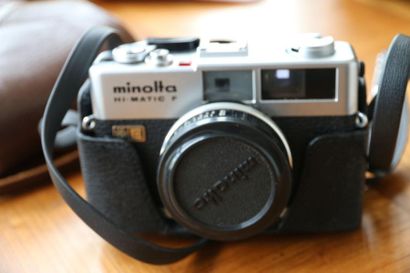 A Minolta Hi Matic F camera with flash (including...