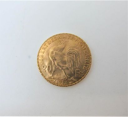 null Une monnaie de 20 francs or au coq, année 1912.