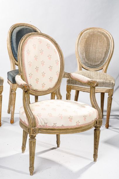 null Suite of six chairs and a medallion backrest chair in lacquered wood. Fluted...