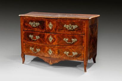 null Chest of drawers with curved front in walnut and fruitwood veneer. The top decorated...
