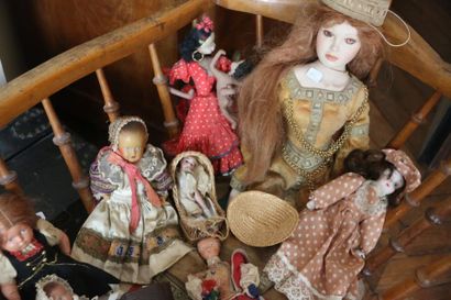 null Set of celluloid porcelain dolls and a plastic rocking horse.
