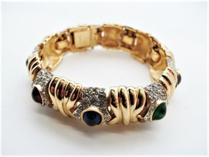 null CINER
Bracelet articulé en métal doré orné de cabochons de verre rouge, vert...
