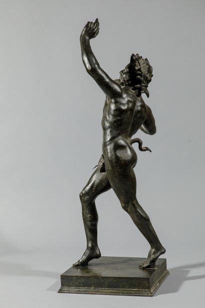 null Dancing fauna in bronze with brown and green patina resting on a square base.

Height:...