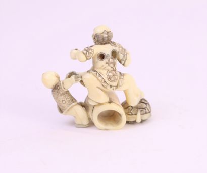 null Ivory okimono enhanced with ink, in the style of the netsuke, depicting a group...