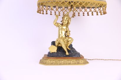 null Group in gilt bronze and patinated bronze mounted as a lamp depicting a small...