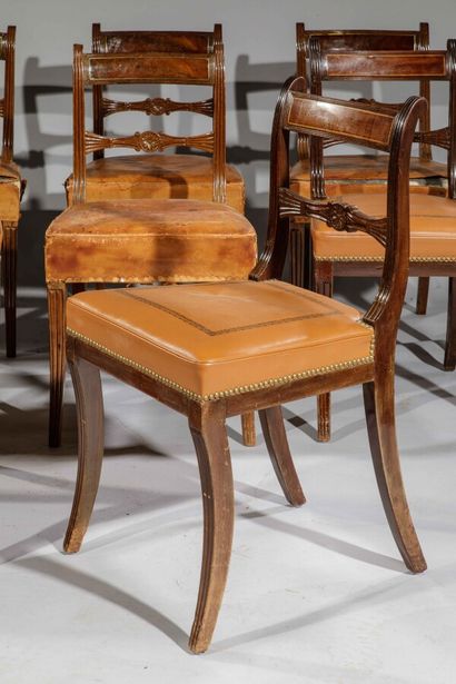 null Suite of ten mahogany chairs. The backrest with band, highlighted with light...