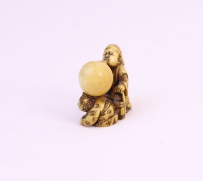 null Netsuke in ivory with yellow patina, two karako playing, one blowing into a...