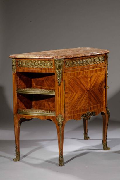 null 
A pair of rosewood veneered sideboards, inlaid with chevron and butterfly wings....