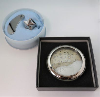 null Thierry Mugler. 

Lot including the cosmic paperweight in silver metal inlaid...