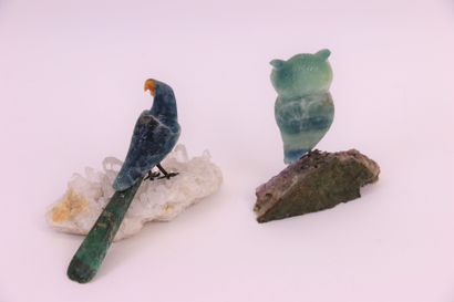 null 
Two fluorite animals representing an owl resting on an amethyst crystal and...