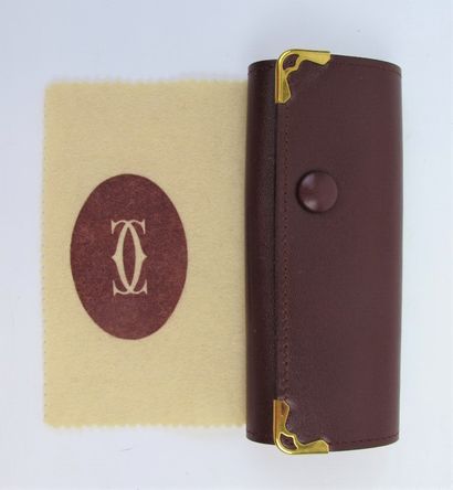 null CARTIER Must de Cartier

Key case in burgundy calf leather, monogrammed embossed...