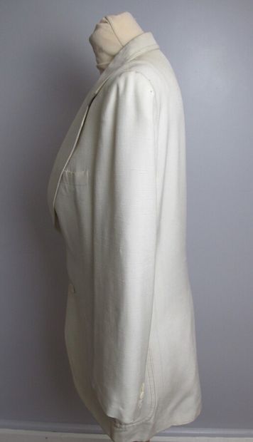 null PIERRE CARDIN

Tuxedo jacket in beige brocaded silk with botheh decoration,...