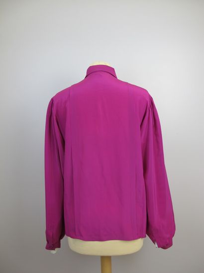 null Set of two blouses:

One in fuchsia pink silk, Claudine collar, closing with...