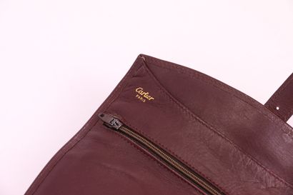 null CARTIER

Burgundy leather jewellery pouch, inside a large pocket, two zipped...