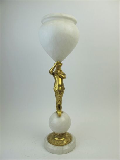 null Deux vases en albâtre, le fût en bronze doré à décor de triton supportant une...