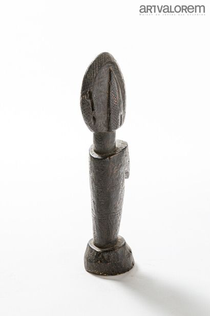 null MOSSI doll (Burkina Faso), female statuette with black crusty patina.

H. 45...