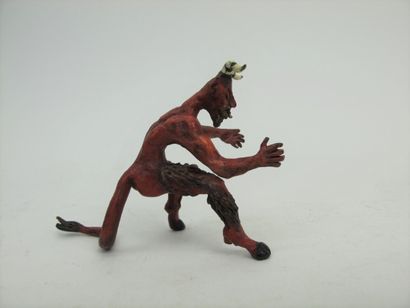 null Erect devil sticking out his tongue in painted bronze.

7 x 7,5 cm