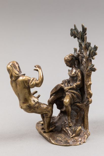 null Gilded bronze group representing a young milkmaid holding a jug, sitting on...