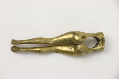 null Gilded bronze nutcracker representing the legs of a woman. 

Early 20th century....