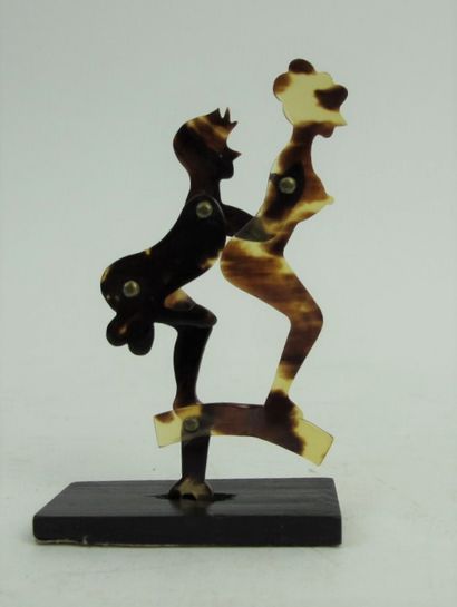 null Couple practicing a pleasure act in articulated bakelite.

About 1930.

H. 7,5...