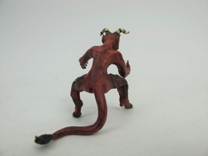 null Erect devil sticking out his tongue in painted bronze.

7 x 7,5 cm