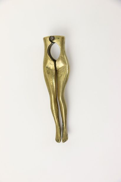 null Gilded bronze nutcracker representing the legs of a woman. 

Early 20th century....
