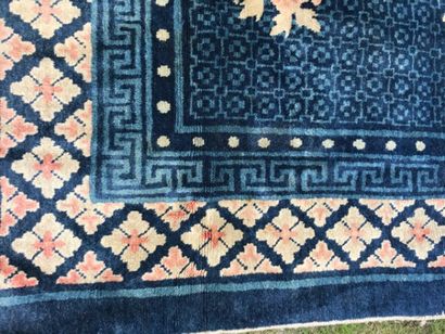 null CHINA 

Wool carpet with navy blue background and polychrome decoration with...