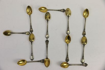 null Twelve coffee spoons 950°/°° in silver with a gilt spoon decorated with scales...