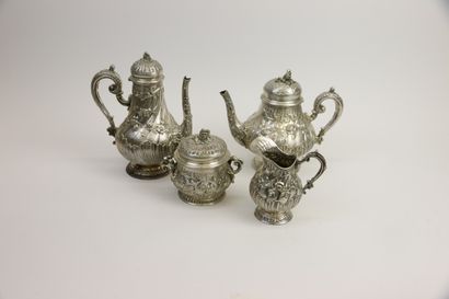 null Four-piece silver tea service 800°/°° with embossed decoration of flowered branches,...