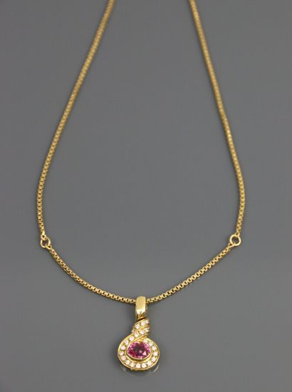 null A yellow gold 750°/°° pendant with an oval shape paved with diamonds centered...