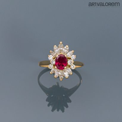 null Yellow gold ring centered on a faceted oval ruby set in navette-cut diamonds.

Weight...