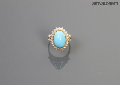 null Yellow gold ring set with an untreated turquoise cabochon from Iran in a diamond...