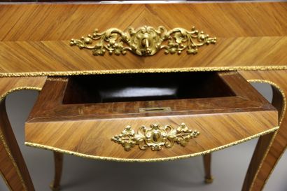 null A rosewood veneered working table with cubes on the top, opening with a drawer...