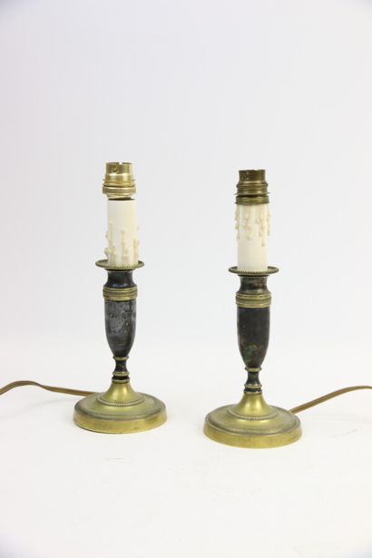 null Pair of electrified gilt and blackened brass torches on pedestal. 

H. 24 c...