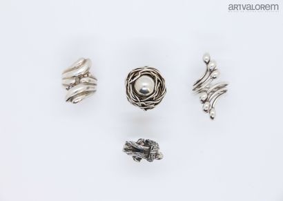 Four silver rings 925°/°° of stylized form,...