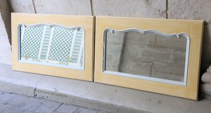 null Two yellow and white painted wood horizontal mirrors with scrolled frames

20th...