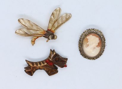 Three brooches one in composition representing...
