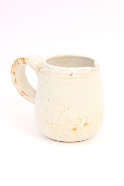 null VALLAURIS. Stoneware pitcher enamelled white with brown coulures and stripes...