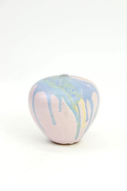 null Small globular stoneware soliflore with blue and yellow glazes on a pink background...