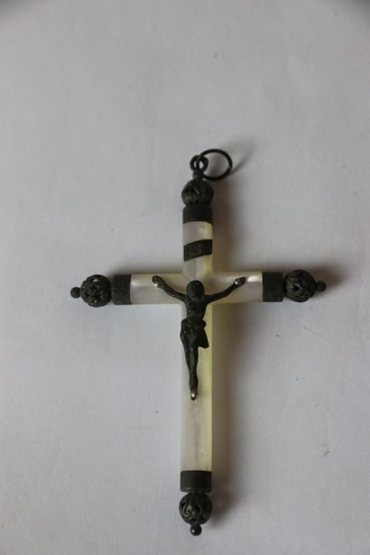 null A mother-of-pearl and metal pendant crucifix and a mother-of-pearl crucifix....