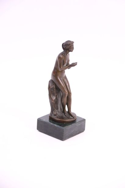 null Naiad on her rock. Bronze with brown patina on a marble base. Foundry Susse...