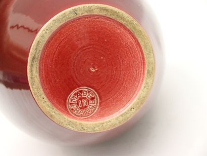 null Pol CHAMBOST, in the taste of

Vase in burgundy enamelled earthenware with globular...
