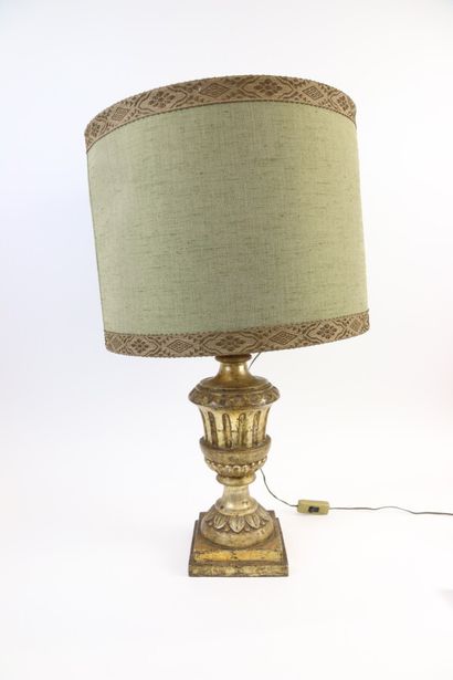null Gilded stucco baluster lamp base decorated with water leaves and gadroons on...
